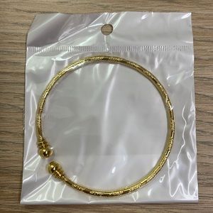 Gold color bracelet, new in bag